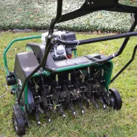 core aeration machine on grass